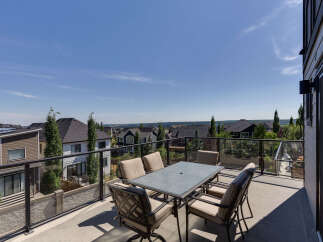 Enjoy breathtaking views from this spacious balcony, perfect for outdoor dining and entertaining.