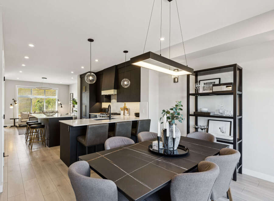 Experience modern luxury in this stunning open-concept kitchen and dining area.