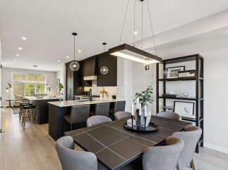 Experience modern luxury in this stunning open-concept kitchen and dining area.