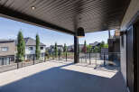 Enjoy breathtaking views from this expansive covered deck, perfect for entertaining or relaxing.