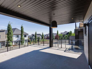Enjoy breathtaking views from this expansive covered deck, perfect for entertaining or relaxing.