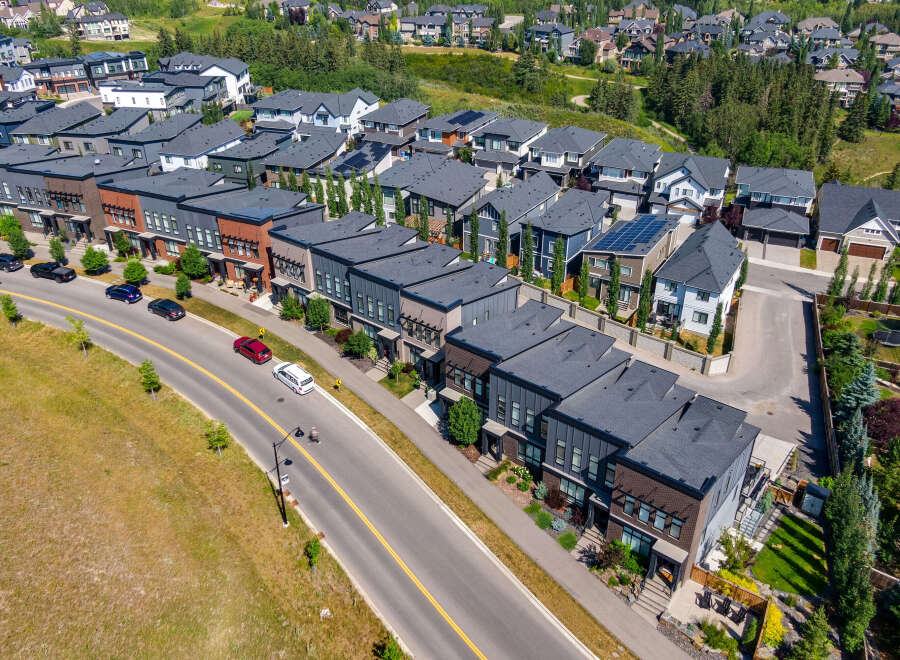 Discover modern living in this stunning aerial view of a contemporary townhouse community.