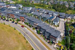 Discover modern living in this stunning aerial view of a contemporary townhouse community.