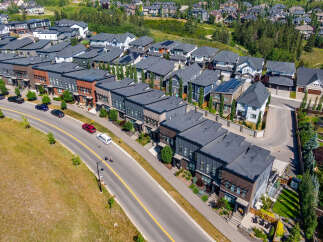 Discover modern living in this stunning aerial view of a contemporary townhouse community.
