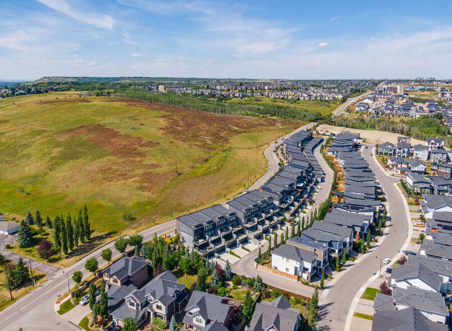 Discover modern living in this stunning aerial view of a contemporary townhouse development.
