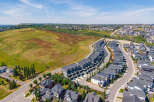 Discover modern living in this stunning aerial view of a contemporary townhouse development.