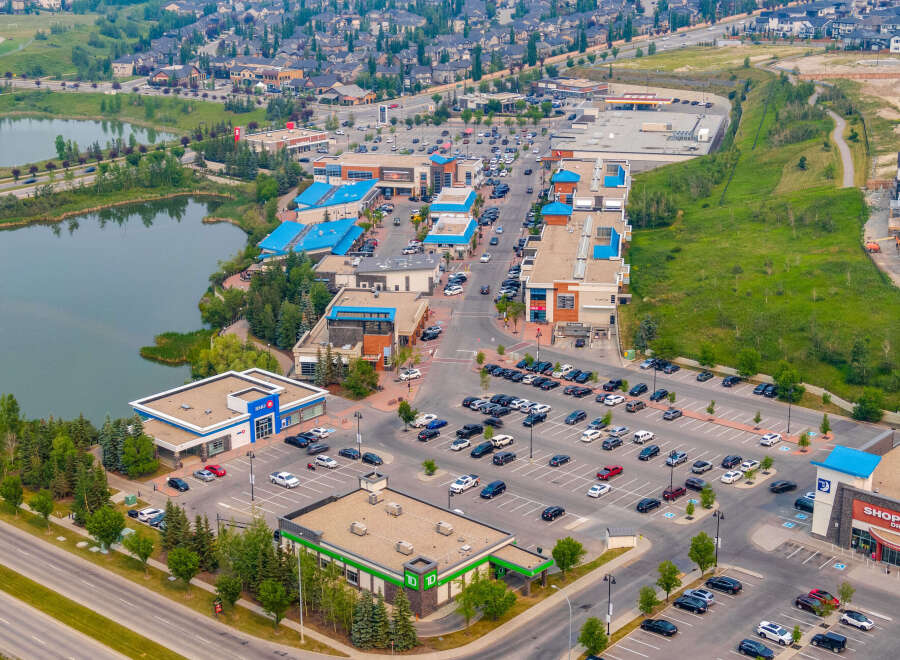Discover this vibrant commercial hub featuring a mix of retail spaces and essential services, including a bank and a drug store.