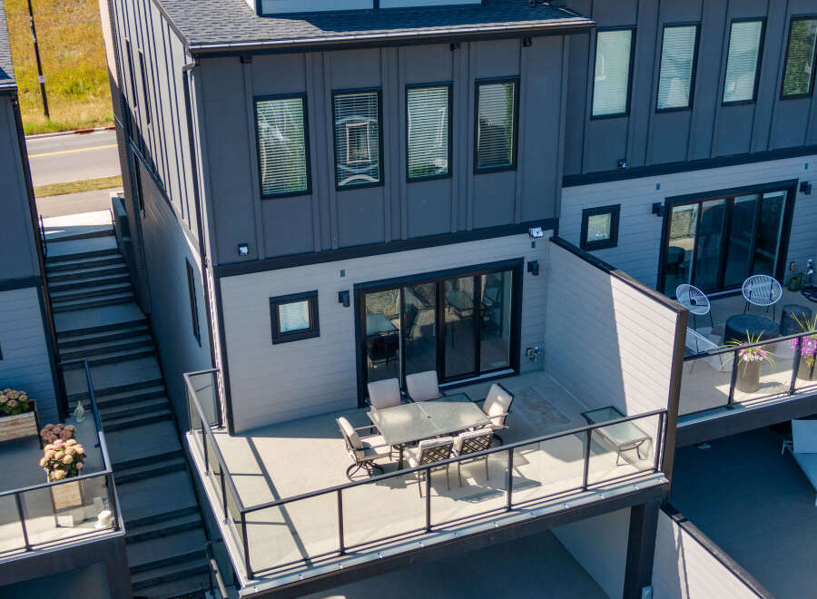 Experience modern living in this stunning townhouse featuring a spacious outdoor patio perfect for entertaining.