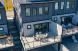 Experience modern living in this stunning townhouse featuring a spacious outdoor patio perfect for entertaining.