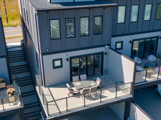 Experience modern living in this stunning townhouse featuring a spacious outdoor patio perfect for entertaining.