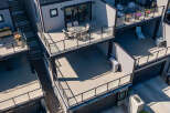 Experience modern urban living with this stunning multi-level townhouse featuring expansive outdoor spaces.
