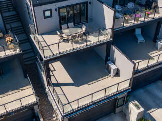 Experience modern urban living with this stunning multi-level townhouse featuring expansive outdoor spaces.