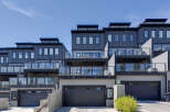 Discover modern living in this stunning townhouse complex featuring sleek architecture and multiple levels of outdoor living space.