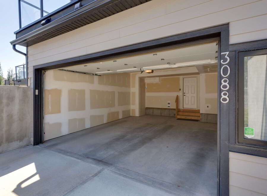 Discover this spacious garage with an open-concept layout, perfect for vehicle storage or a workshop.