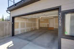 Discover this spacious garage with an open-concept layout, perfect for vehicle storage or a workshop.