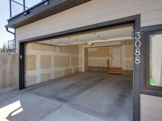 Discover this spacious garage with an open-concept layout, perfect for vehicle storage or a workshop.