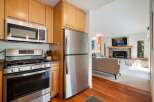 Experience modern living in this beautifully appointed kitchen, featuring sleek stainless steel appliances including a gas range and a microwave.