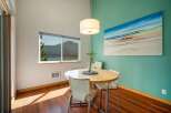 Enjoy breathtaking lake and mountain views from this charming dining area, perfect for intimate meals or morning coffee.