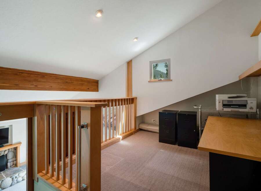 Discover a versatile loft space perfect for a home office or creative studio.