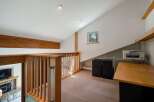 Discover a versatile loft space perfect for a home office or creative studio.