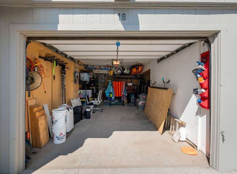 Discover ample storage solutions in this spacious garage, perfect for organizing all your tools and recreational gear.