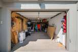 Discover ample storage solutions in this spacious garage, perfect for organizing all your tools and recreational gear.