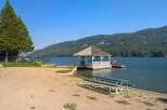 Enjoy lakeside living with this charming property featuring a private gazebo and dock, perfect for summer days on the water.