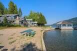 Enjoy lakeside living with this stunning property featuring a private beach and a charming gazebo perfect for relaxing by the water.