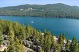 Experience breathtaking lakefront living with this stunning property nestled among towering pine trees.