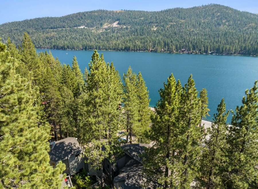 Experience breathtaking lake views from this stunning property nestled amongst towering pine trees.