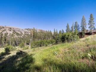 Nestled amidst a serene mountain landscape, this property offers a tranquil retreat with stunning natural beauty.