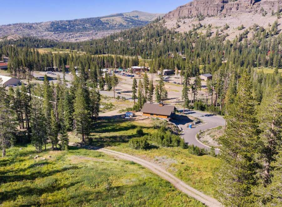 Nestled amidst a serene pine forest and rolling hills, this property offers a unique opportunity for development or a private mountain retreat.
