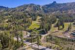 Nestled amidst a lush pine forest, this property offers a serene mountain retreat with stunning views of ski slopes and rugged peaks.
