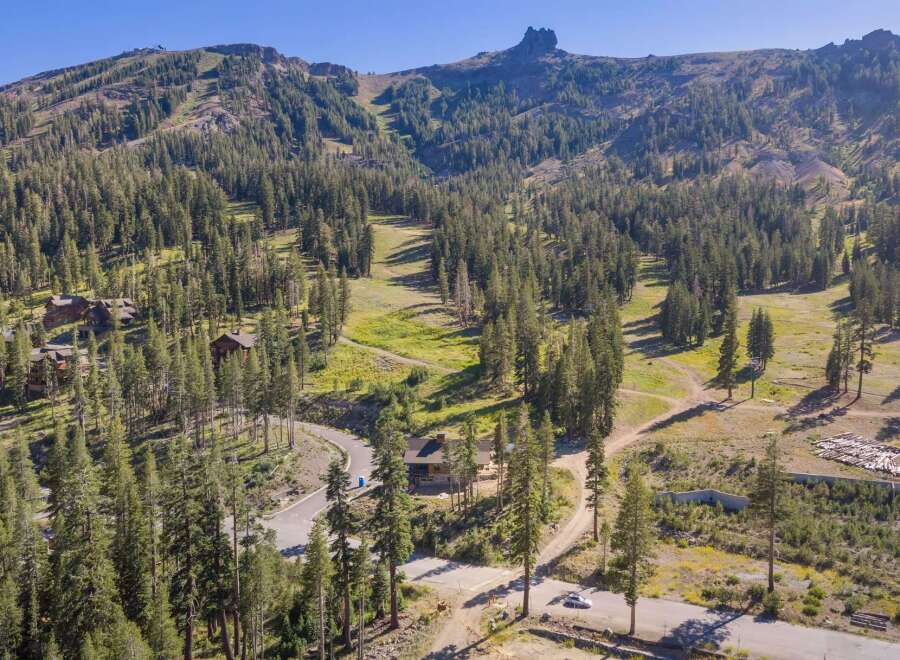 Nestled amidst a lush pine forest, this stunning mountain property offers breathtaking views and serene seclusion.