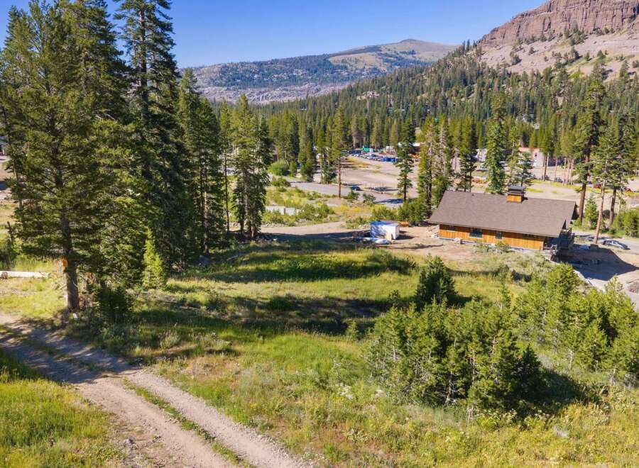 Nestled amidst a serene mountain landscape, this property offers a unique blend of natural beauty and potential.