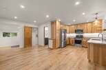 Discover this beautifully renovated kitchen featuring warm, natural wood cabinetry and sleek stainless steel appliances.