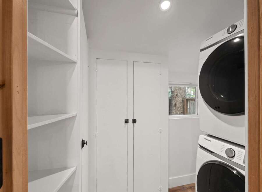 Discover efficient living with this stacked Samsung washer and dryer set, perfect for maximizing space in your laundry area.