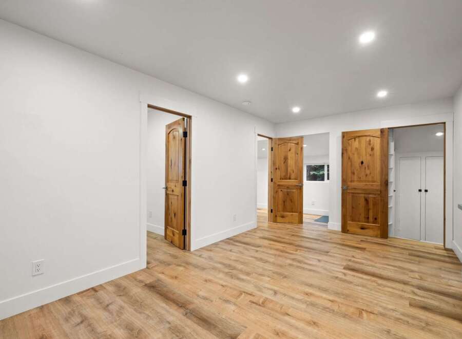 Discover this stunning interior featuring warm, rustic wooden doors that add a touch of natural elegance to the space.
