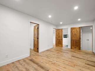 Discover this stunning interior featuring warm, rustic wooden doors that add a touch of natural elegance to the space.