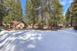 Nestled among tall pine trees, this property offers a serene mountain escape.