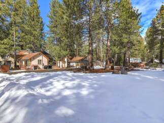 Nestled among tall pine trees, this property offers a serene mountain escape.