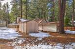 Nestled amongst tall pine trees, this property offers a unique blend of rustic charm and potential.