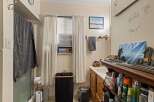 This bathroom offers a functional and organized space with ample storage.
