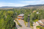 Discover this stunning modern home nestled amidst lush greenery and rolling hills.