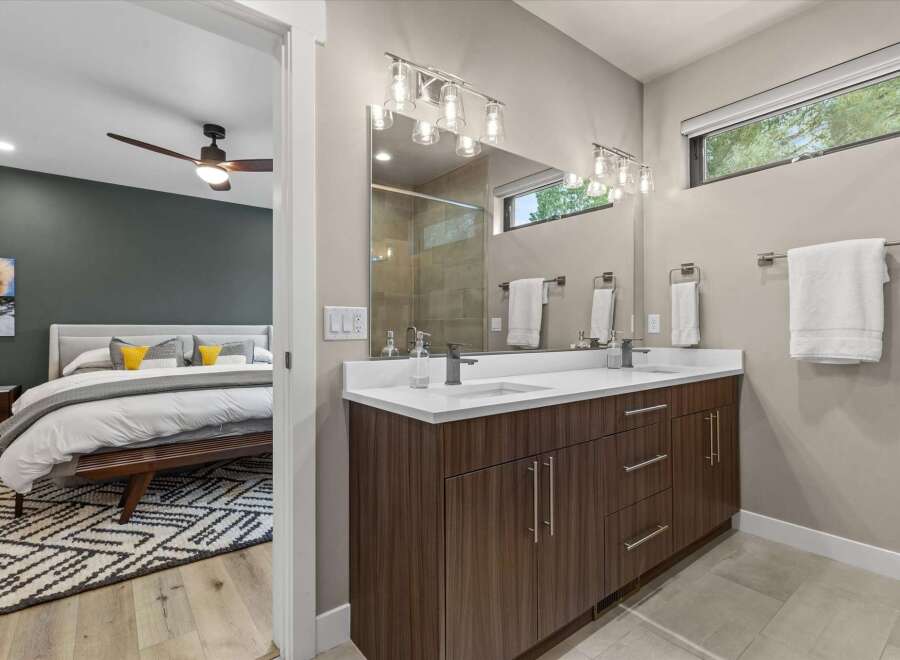 Experience modern luxury in this stunning bedroom and en-suite bathroom.