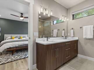 Experience modern luxury in this stunning bedroom and en-suite bathroom.