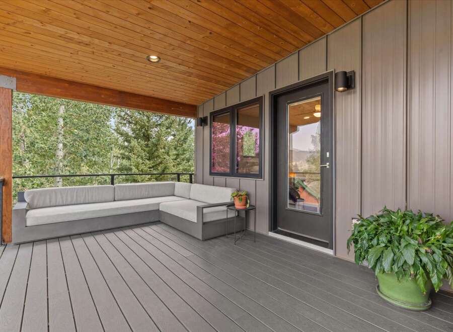 Enjoy the stunning mountain views from this expansive covered deck, perfect for outdoor living and entertaining.
