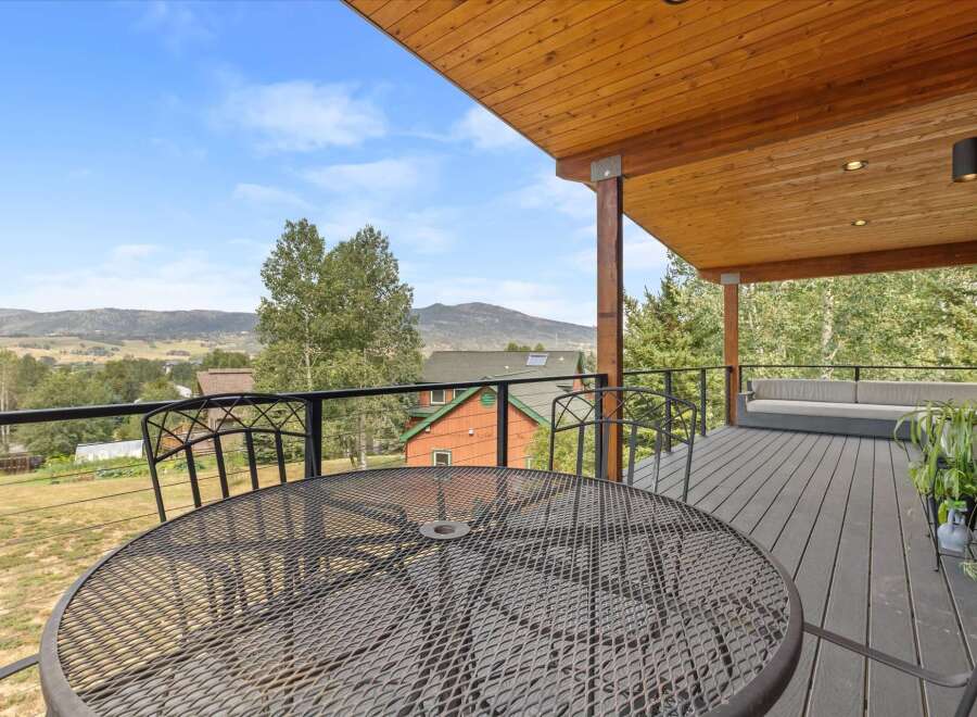 Enjoy breathtaking mountain views from this expansive deck, perfect for outdoor entertaining or quiet relaxation.