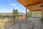 Enjoy breathtaking mountain views from this expansive deck, perfect for outdoor entertaining or quiet relaxation.