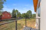 Enjoy the stunning mountain views from this modern home's private balcony, featuring sleek cable railings.
